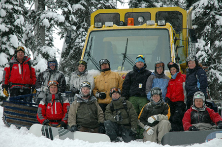 Ski Class standing by snow cat