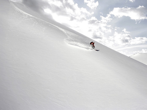 Skier off-piste in untracked snow
